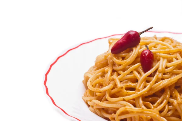Spaghetti with tomato and red hot chili peppers — Stock Photo, Image