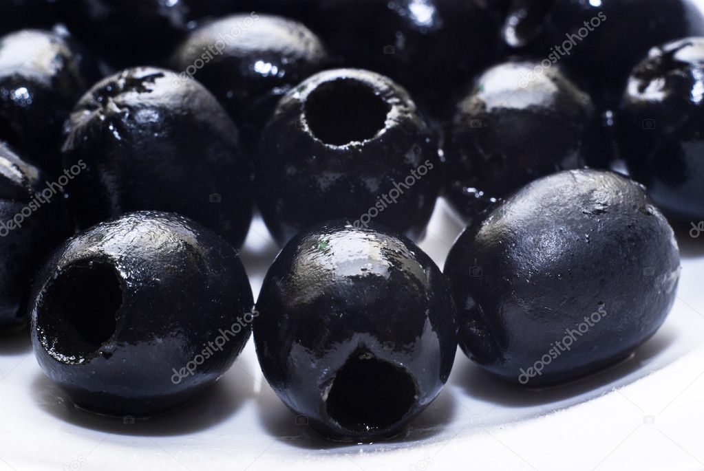 Black pitted olives isolated