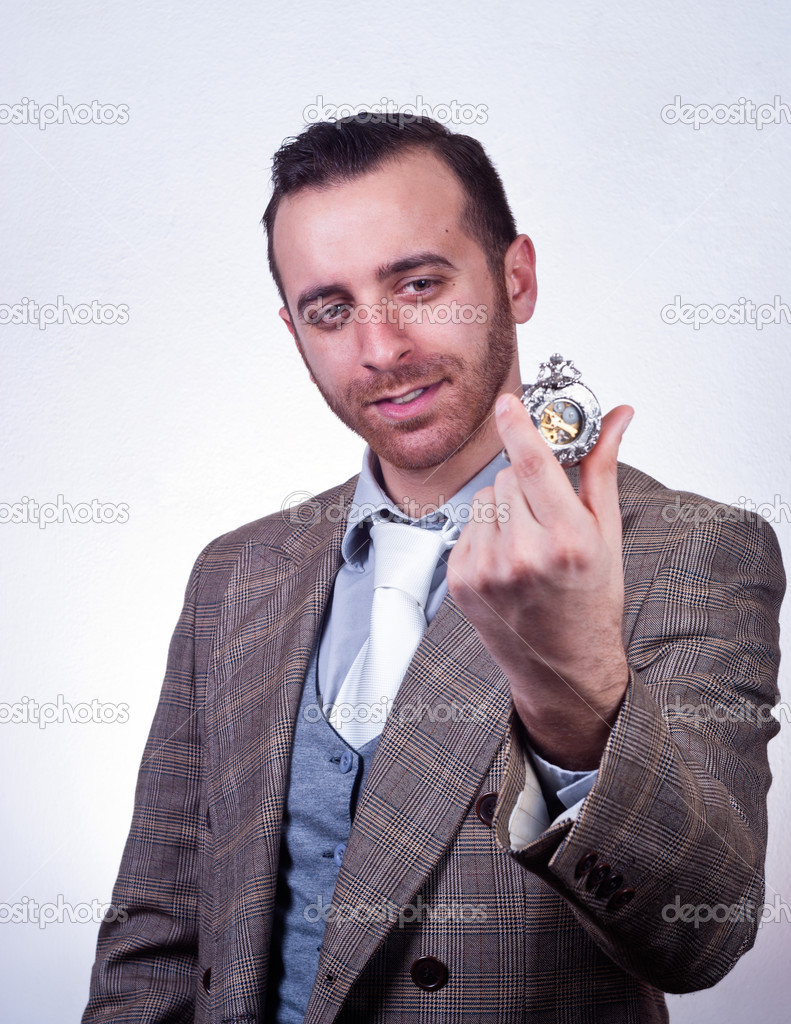 elegant man looking his old pocket watch