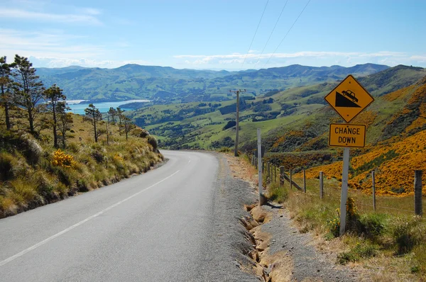 Yellow road sign change down — Stock Photo, Image