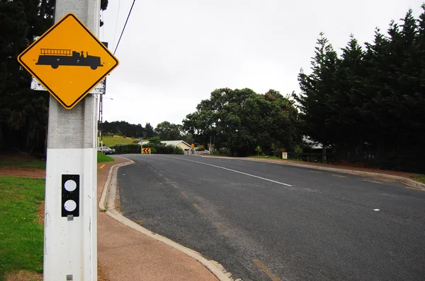 Yellow fire service road sign in town — Stock Photo, Image