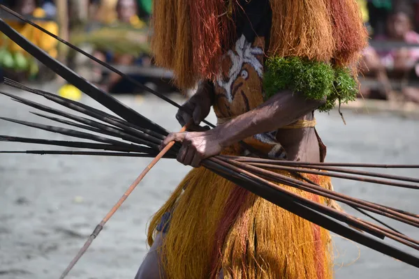 Man with bow and arrow traditional tribal weapon — Stock Photo, Image