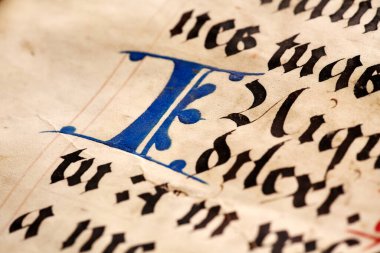 LVIV, UKRAINE - April 4, 2020: manuscripts in the medieval library. Books printing in Europe in the 1450s to the end of the 15th century. Artistic selective focus.