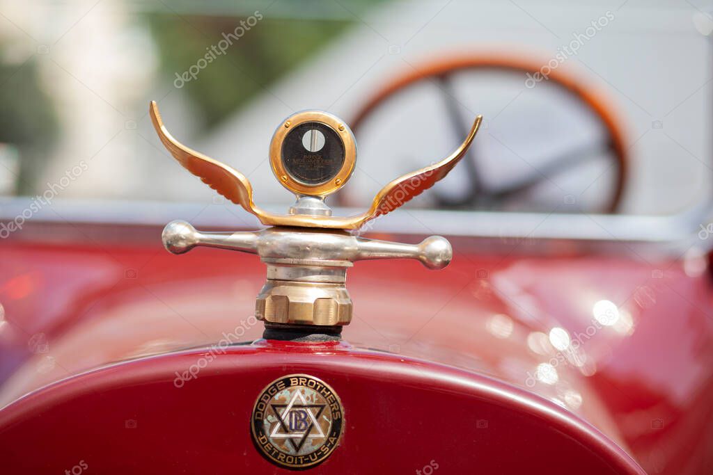 LVIV, UKRAINE - June 21, 2013: Boyce Motometer thermostat in the form of car emblem. Dodge Brothers logo on vintage car. Selective focus