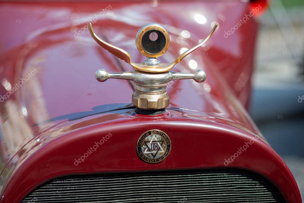 LVIV, UKRAINE - June 21, 2013: Boyce Motometer thermostat in the form of car emblem. Dodge Brothers logo on vintage car. Selective focus