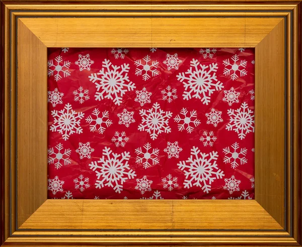 Bílé Sněhové Vločky Červeném Zmačkaném Obalu Zlatém Rámu Vánoční Dovolená — Stock fotografie