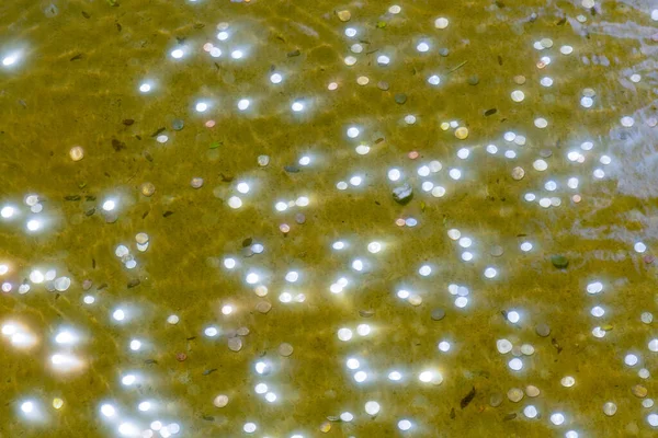 Bunch Coins Underwater Wishing Well Pond Reflecting Sun — Foto de Stock