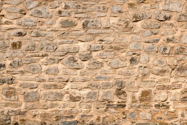 두꺼운 분쇄기와 거칠거칠 표면으로 석벽을 클로즈업 — 스톡 사진