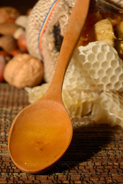 Golden honey with fruits — Stock Photo, Image