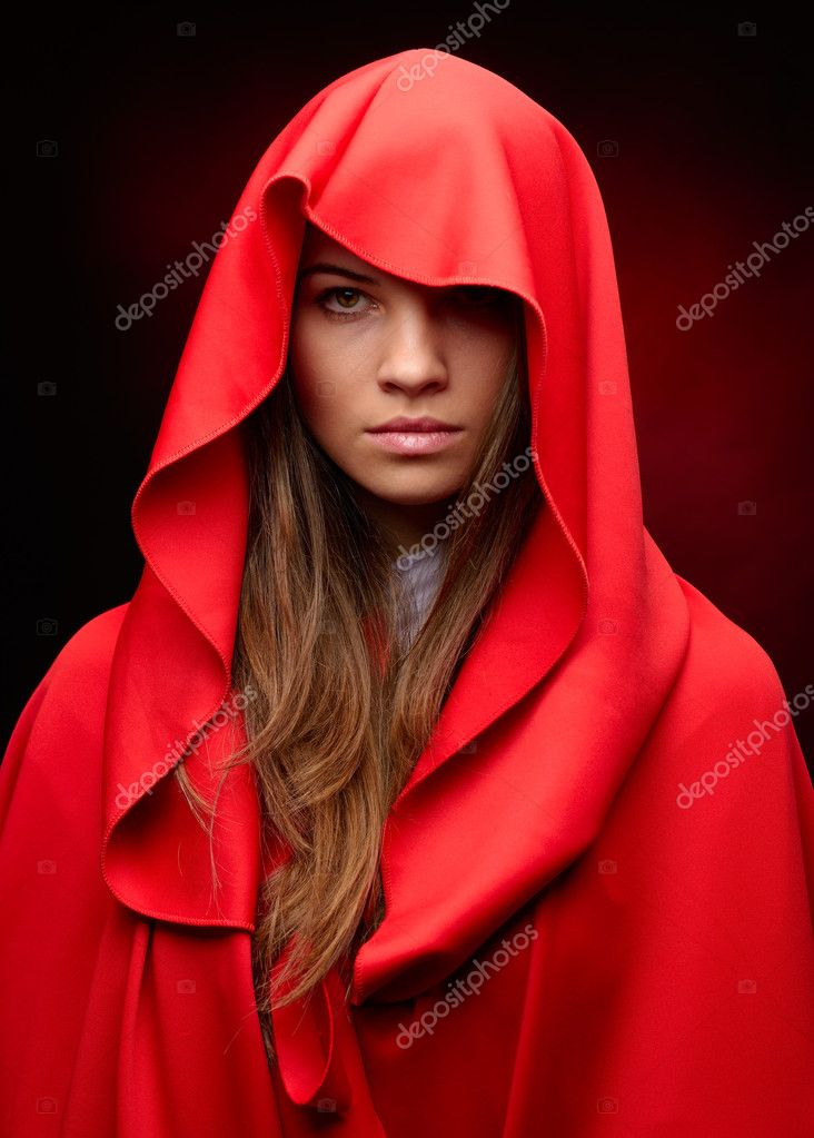 Beautiful woman with red cloak in studio — Stock Photo © bereta 43028691