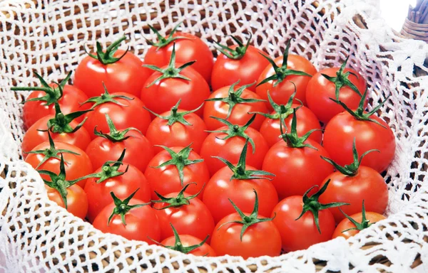 Tomatoes in basket — Stock Photo, Image