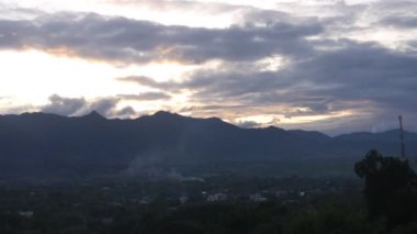 From Landscape With Flora To Mountain In Black Light Under Cloudy Sunset Sky - Static, Then Zoom And Slide Left To Right