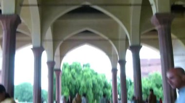 Ceiling Over Father And Daughter Walking Near Pillars - Tilt Up To Down, Then Pan Right To Left
