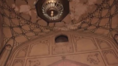 Ceiling Over Men In Front Of Sunny Door - Tilt - Up To Down