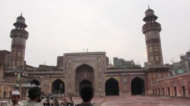 Men Walking In Mosque - Tilt - Up To Down