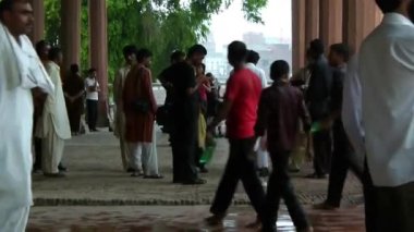 Men Walking Surrounded By Pillars - Static
