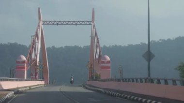 Driving On Bridge Near Mountain And Motorbike - Slide Forward 