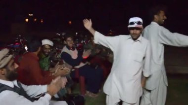 Men Dancing At Night Near People Clapping - Handheld