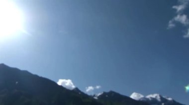 Sun Over Water Source Surrounded By Mountains - Pan And Tilt - Up Left To Down Right 