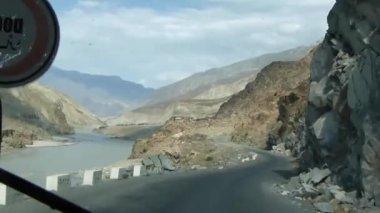 Driving Past Rocks And Mountains - Slide Forward 