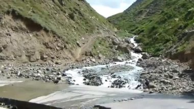 Turning Left On Road Over Water Source - Slide Forward 