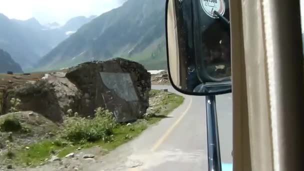 Rear View Mirror While Driving Mountains Slide Forward — стоковое видео