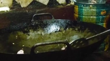 Chicken In Cooking Stove Being Stirred - Handheld