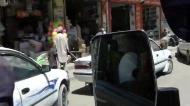 Rear View Window Near Stores, Cars And People - Slide And Handheld - Left To Right