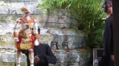 Man Wearing Black Mask Holding Traditional Puppet - Handheld 