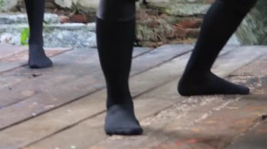 Man Wearing Black Mask Ballet Dancing - Slide And Handheld - Down To Up