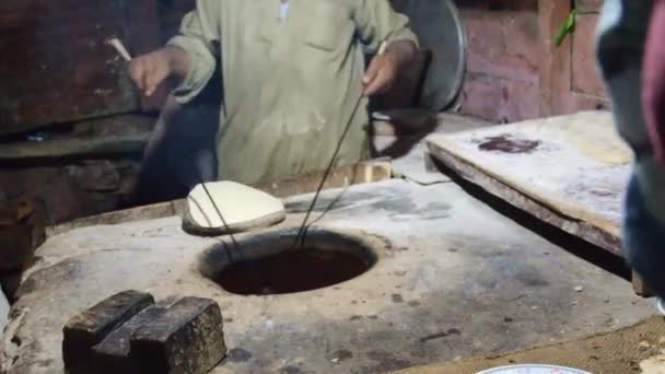Man Taking Cooked Bread Out Oven Handheld — Stok video