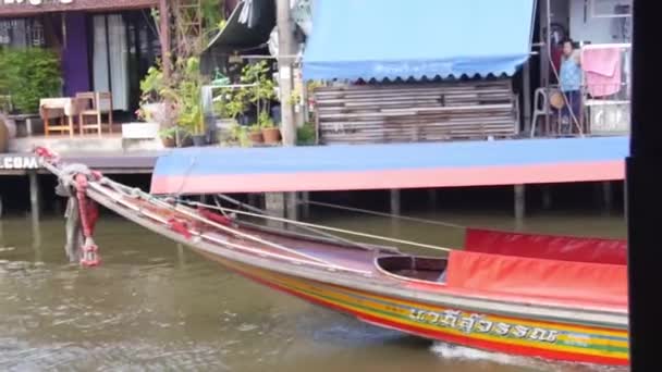 Colorful Boat Passing House Water Source Static — Video