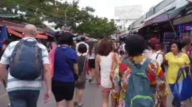 Walking In Very Busy Street Surrounded By Crowd And Shops - Slide Forward