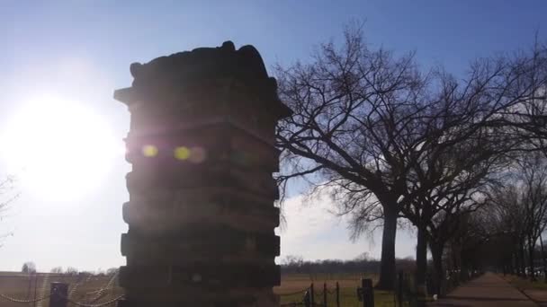Sun Ray Shining Monument Dry Trees Pan Right Left — Stock Video