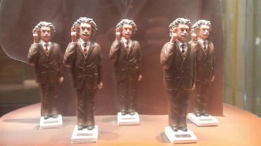 Albert Einstein Moving Figurine On Shelf Behind Showcase - Static
