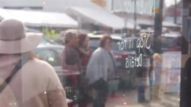 Market Showcase With Reflection Of People - Static