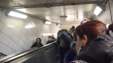 People Going Up And Down Subway Escalator - Slide Forward
