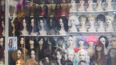 Wigs Exposed On Mannequins On Shelves - Static