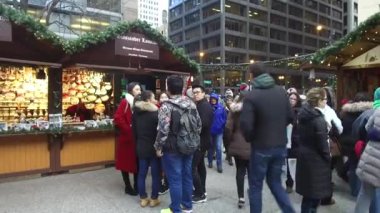 People In Queue In Front Of Food Stand - Handheld