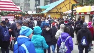 People With Bonnets Walking In Christmas Market - Static - Slow Motion