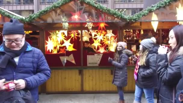 Girl Taking Pictures Her Phone Front Christmas Market Stand Slide — Vídeos de Stock