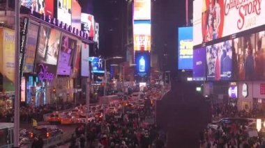 Adverts On Buildings Over Crowd At Night - Static