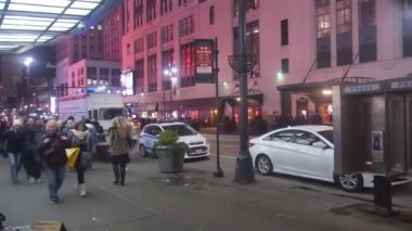 People Walking By Homeless Person Things On The Floor In Street - Pan - Right To Left