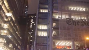 The New York Times Building Near Street Lanterns From Below - Pan - Left To Right