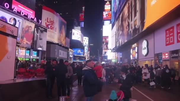 Crowded Square Night Surrounded Buildings Pan Right Left — Stockvideo