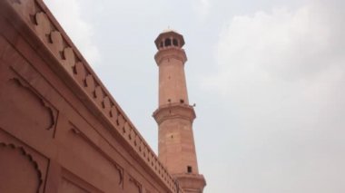 Mosque Tower And Wall Under The Sky - Static