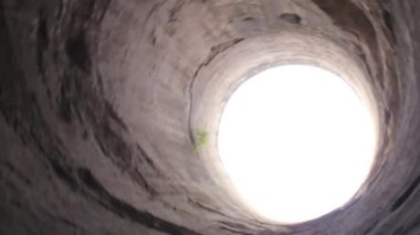 Spinning Around While Looking At Round Open Ceiling From Below - Pan - Left To Right