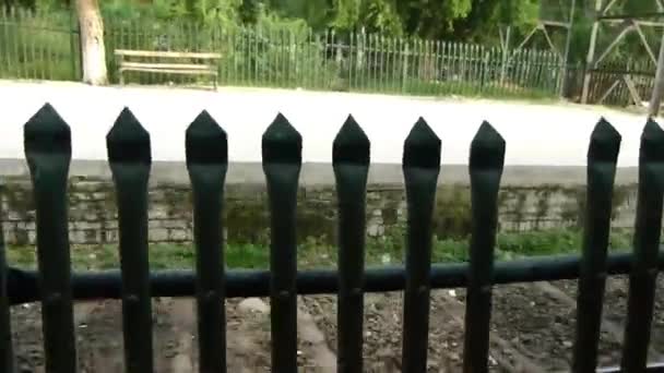 Passing Spiky Fence Slide Right Left — Stock video