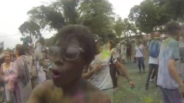 Walking Past Man Covered By Colorful Powder - Walking Forward.