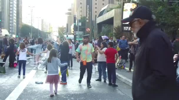 Man Beard Walking Excited Children Playing Big Bubbles Static Slow — Stock Video